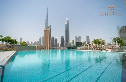 Pool image for: Apartment - 1 Bedroom - 2 Bathrooms for rent in Downtown Views II Tower 2 - Downtown Views II - Downtown Dubai - Dubai, Image 1