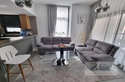 Living Room image for: Apartment - 1 Bedroom - 2 Bathrooms for sale in Darb 4 - Al Mamsha - Muwaileh - Sharjah, Image 1