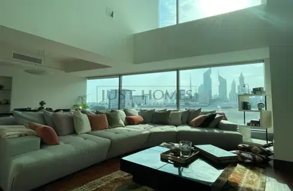 Living Room image for: Apartment - 2 Bedrooms - 3 Bathrooms for sale in Jumeirah Living - World Trade Centre Residence - World Trade Center - Dubai, Image 1