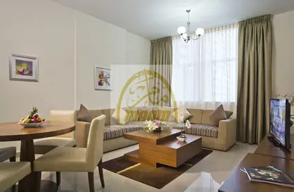Living / Dining Room image for: Apartment - 2 Bedrooms - 2 Bathrooms for rent in Pearl MAAM Residence - Sultan Bin Zayed the First Street - Muroor Area - Abu Dhabi, Image 1
