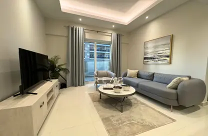 Living Room image for: Apartment - 1 Bedroom - 1 Bathroom for sale in Hera Tower - Dubai Sports City - Dubai, Image 1