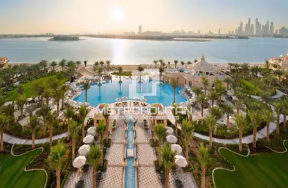 Pool image for: Apartment - 1 Bathroom for sale in Raffles The Palm - The Crescent - Palm Jumeirah - Dubai, Image 1
