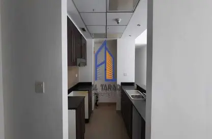 صورة لـ مطبخ شقة - 2 غرف نوم - 2 حمامات للايجار في برج 2 - الريف داون تاون - مشروع الريف - أبوظبي ، صورة رقم 1