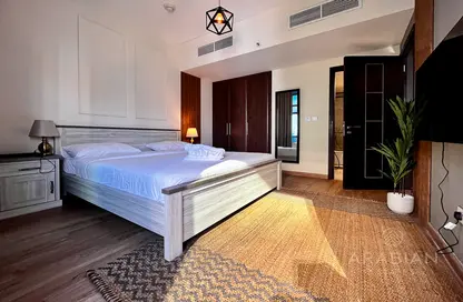 Room / Bedroom image for: Apartment - 1 Bedroom - 2 Bathrooms for sale in Indigo Tower - Lake Almas East - Jumeirah Lake Towers - Dubai, Image 1