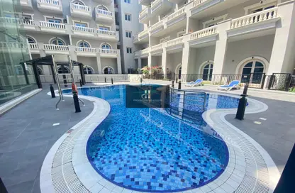 Pool image for: Apartment - 1 Bedroom - 2 Bathrooms for rent in Autumn - Seasons Community - Jumeirah Village Circle - Dubai, Image 1