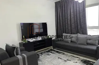 Living Room image for: Apartment - 1 Bedroom - 1 Bathroom for rent in Carson B - Carson - DAMAC Hills - Dubai, Image 1