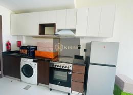 Kitchen image for: Studio - 1 bathroom for rent in Wavez Residence - Liwan - Dubai Land - Dubai, Image 1