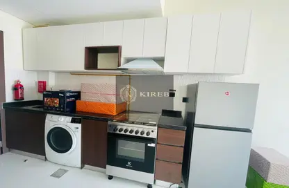 Kitchen image for: Apartment - 1 Bathroom for rent in Wavez Residence - Liwan - Dubai Land - Dubai, Image 1