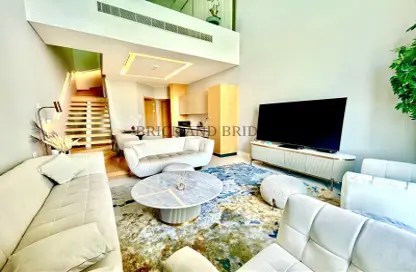Living Room image for: Apartment - 1 Bedroom - 2 Bathrooms for rent in SLS Dubai Hotel  and  Residences - Business Bay - Dubai, Image 1