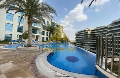 Pool image for: Apartment - 1 Bedroom - 2 Bathrooms for rent in Al Zeina - Al Raha Beach - Abu Dhabi, Image 1