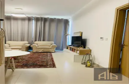 Living Room image for: Apartment - 1 Bedroom - 2 Bathrooms for sale in Ajmal Makan City - Al Hamriyah - Sharjah, Image 1