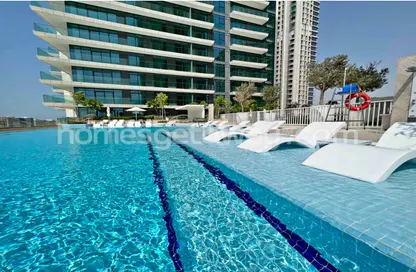Pool image for: Apartment - 2 Bedrooms - 2 Bathrooms for rent in Beach Vista - EMAAR Beachfront - Dubai Harbour - Dubai, Image 1
