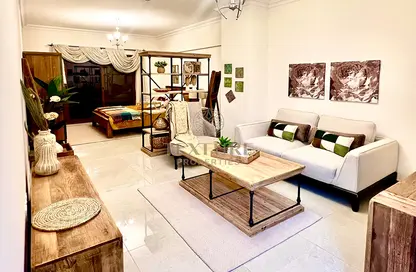 Living Room image for: Apartment - 1 Bathroom for sale in Rokane G24 - Al Warsan 4 - Al Warsan - Dubai, Image 1