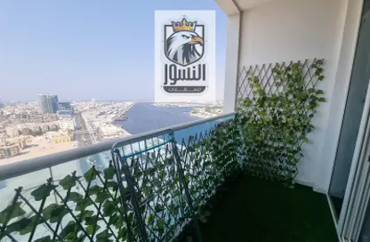 Balcony image for: Apartment - 1 Bedroom - 2 Bathrooms for rent in Oasis Tower - Al Rashidiya 1 - Al Rashidiya - Ajman, Image 1
