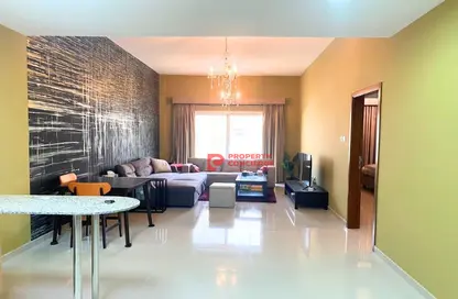 Living Room image for: Apartment - 1 Bedroom - 2 Bathrooms for sale in Madison Columbus - Majan - Dubai, Image 1