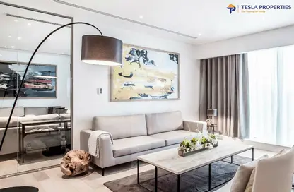 Living Room image for: Apartment - 1 Bedroom - 2 Bathrooms for sale in Waves Grande - Sobha Hartland - Mohammed Bin Rashid City - Dubai, Image 1