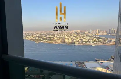 شقة - غرفة نوم - 2 حمامات للايجار في أورينت تاور 1 - أورينت تاور - البستان - عجمان