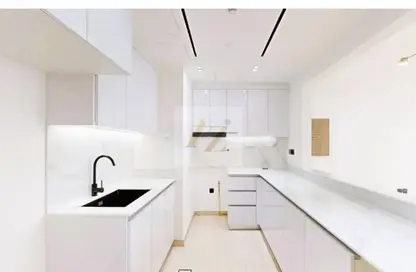 صورة لـ مطبخ شقة - 2 غرف نوم - 3 حمامات للبيع في بن غاطي كريست - قرية الجميرا سركل - دبي ، صورة رقم 1