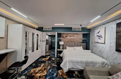 صورة لـ غرفة- غرفة النوم شقة - 1 حمام للايجار في باسيفيك بورا بورا - باسيفيك - جزيرة المرجان - رأس الخيمة ، صورة رقم 1