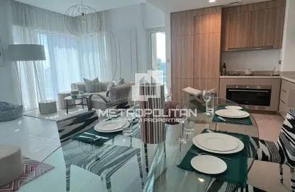 Living / Dining Room image for: Apartment - 2 Bedrooms - 2 Bathrooms for sale in Urban Oasis - Business Bay - Dubai, Image 1