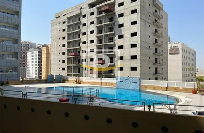 صورة لـ حوض سباحة شقة - غرفة نوم - 2 حمامات للبيع في تلال السيليكون 2 - تلال السيليكون - واحة السيليكون - دبي ، صورة رقم 1