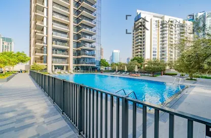 Pool image for: Apartment - 3 Bedrooms - 2 Bathrooms for sale in Boulevard Crescent 1 - BLVD Crescent - Downtown Dubai - Dubai, Image 1