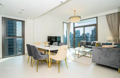 Living / Dining Room image for: Apartment - 2 Bedrooms - 2 Bathrooms for rent in Burj Crown - Downtown Dubai - Dubai, Image 1