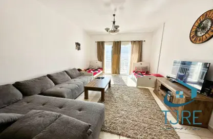 Living Room image for: Apartment - 1 Bedroom - 2 Bathrooms for sale in Gardenia 1 - Emirates Gardens 1 - Jumeirah Village Circle - Dubai, Image 1