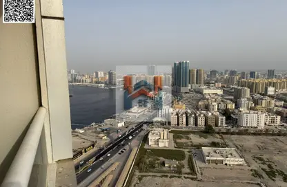 شقة - غرفة نوم - 2 حمامات للايجار في أورينت تاور 1 - أورينت تاور - البستان - عجمان