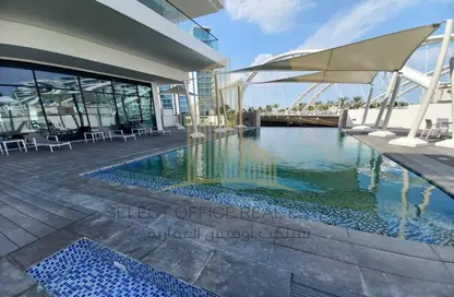 صورة لـ حوض سباحة شقة - غرفة نوم - 2 حمامات للايجار في البيد تيراس - شاطئ الراحة - أبوظبي ، صورة رقم 1