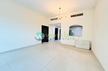 Empty Room image for: Apartment - 1 Bedroom - 2 Bathrooms for rent in Al Yousuf Towers - District 12 - Jumeirah Village Circle - Dubai, Image 1