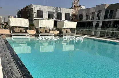 صورة لـ حوض سباحة شقة - غرفة نوم - 2 حمامات للايجار في بن غاطي كريست - قرية الجميرا سركل - دبي ، صورة رقم 1