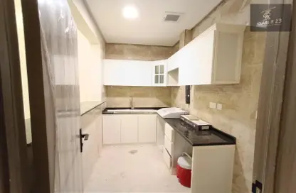Kitchen image for: Apartment - 1 Bathroom for rent in Mohammed Villas 6 - Mohamed Bin Zayed City - Abu Dhabi, Image 1