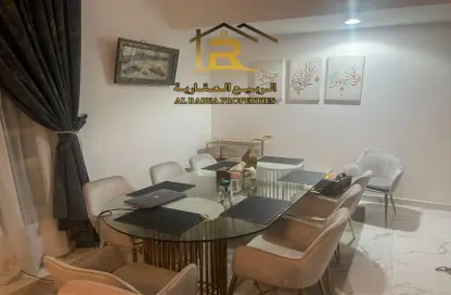 Dining Room image for: Apartment - 2 Bedrooms - 3 Bathrooms for sale in Oasis Tower - Al Rashidiya 1 - Al Rashidiya - Ajman, Image 1