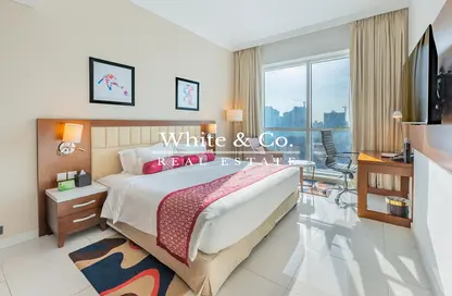 Room / Bedroom image for: Apartment - 1 Bedroom - 1 Bathroom for rent in Treppan Hotel  and  Suites by Fakhruddin - Dubai Sports City - Dubai, Image 1