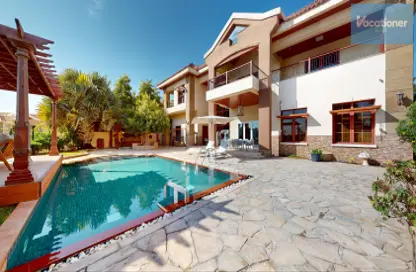 Pool image for: Villa - 5 Bedrooms - 5 Bathrooms for rent in The Mansions - Jumeirah Islands - Dubai, Image 1
