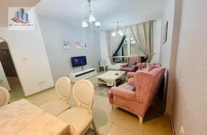 Living / Dining Room image for: Apartment - 2 Bedrooms - 2 Bathrooms for rent in Rose Tower - Al Khan - Sharjah, Image 1