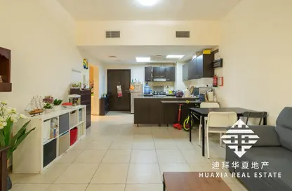 Living / Dining Room image for: Apartment - 1 Bedroom - 1 Bathroom for sale in Al Thamam 20 - Al Thamam - Remraam - Dubai, Image 1
