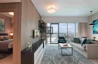 Living Room image for: Hotel  and  Hotel Apartment - 1 Bedroom - 1 Bathroom for rent in Millennium Montrose Executive Apartment - Dubai Science Park - Dubai, Image 1