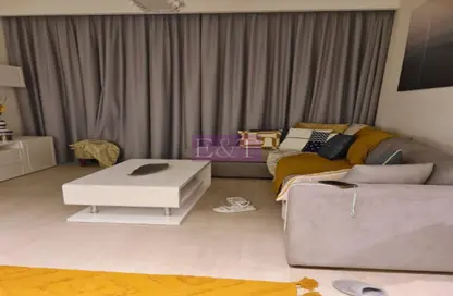 Living Room image for: Apartment - 1 Bedroom - 2 Bathrooms for sale in AZIZI Riviera - Meydan One - Meydan - Dubai, Image 1