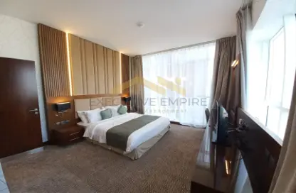 Room / Bedroom image for: Apartment - 1 Bathroom for rent in Junaibi Tower - Al Danah - Abu Dhabi, Image 1