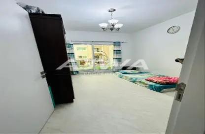 Room / Bedroom image for: Apartment - 2 Bedrooms - 3 Bathrooms for sale in Mazaya 29 - Queue Point - Dubai Land - Dubai, Image 1