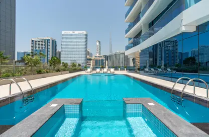 Pool image for: Apartment - 1 Bathroom for rent in Waves Tower - Business Bay - Dubai, Image 1