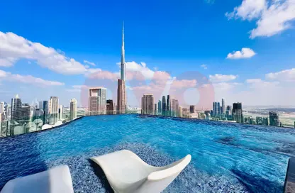 Pool image for: Apartment - 1 Bedroom - 2 Bathrooms for rent in Paramount Tower Hotel  and  Residences - Business Bay - Dubai, Image 1
