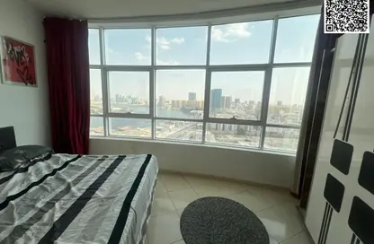 شقة - غرفة نوم - 2 حمامات للايجار في أورينت تاور 1 - أورينت تاور - البستان - عجمان