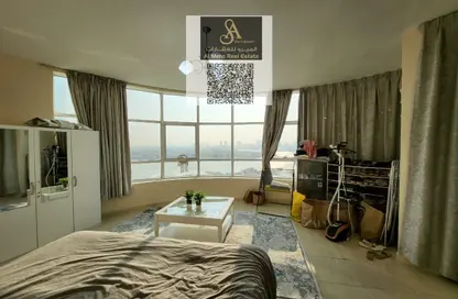 شقة - غرفة نوم - 2 حمامات للايجار في أورينت تاور 1 - أورينت تاور - البستان - عجمان