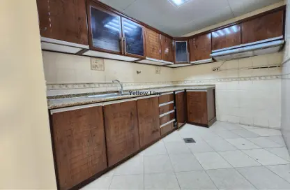 Kitchen image for: Duplex - 2 Bedrooms - 2 Bathrooms for rent in Khalifa City A - Khalifa City - Abu Dhabi, Image 1