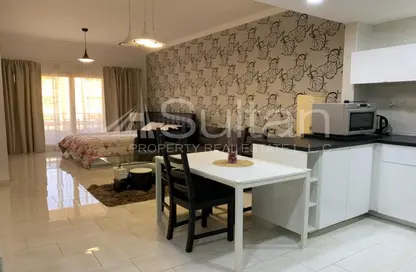 Living / Dining Room image for: Apartment - 1 Bathroom for sale in Golf Apartments - Al Hamra Village - Ras Al Khaimah, Image 1