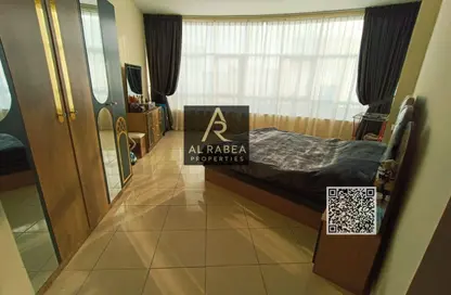 شقة - غرفة نوم - 2 حمامات للايجار في أورينت تاور 1 - أورينت تاور - البستان - عجمان