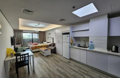 Kitchen image for: Apartment - 1 Bathroom for rent in Laya Mansion - Jumeirah Village Circle - Dubai, Image 1